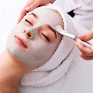 Esthetics - A woman getting a facial mask treatment. The benefits of a European Facial