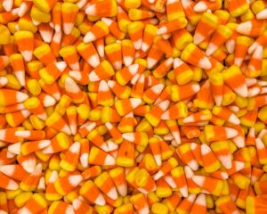 a pile of orange and white candy corn