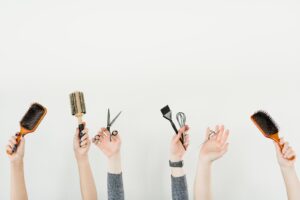 cosmetology tools - hair brush, scissors