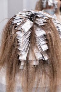 hair bleaching - brown hair with white ribbon