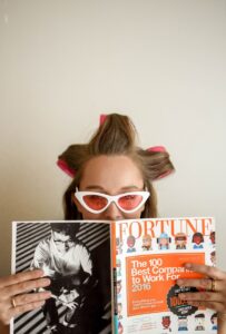 Preventing Split Ends - woman holding Fortune magazine