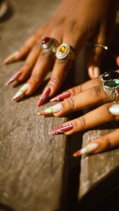 A close up of a person's hands with rings on them | Nail Art Trends 2024