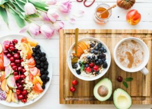 black and red cherries on white bowl | skin health