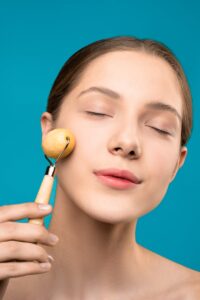 Woman Using Facial Roller