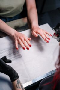 Person with Red Manicure