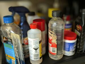 A bunch of bottles are sitting on a shelf | Bad Ingredients