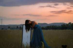 a person in a dress in a field | negative body image