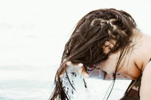 woman in body of water | Wash your hair