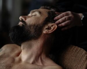 Gentle head massage therapy session for relaxation and stress relief.