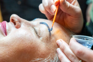 Step-by-step brow lamination process showing solution application