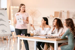 Students in beauty career paths training program learning skin anatomy