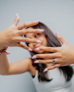 Woman with manicured nails and rings | Nail Trends 2026