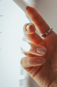 a woman's hand with a ring on it